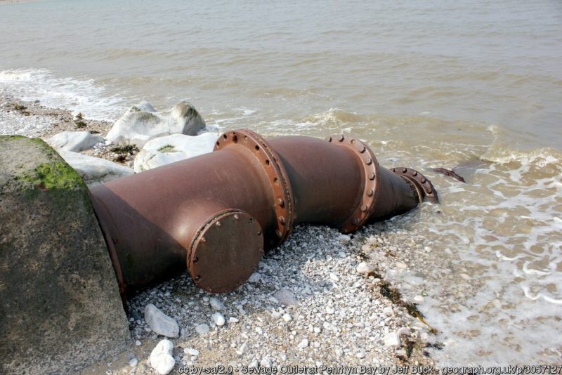 Photograph shows a sewage outlet