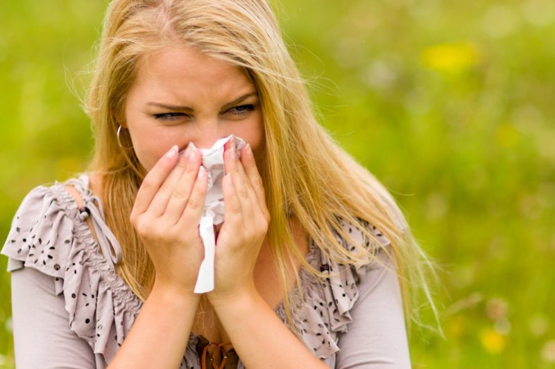 Photograph shows a woman with Hay Fever.