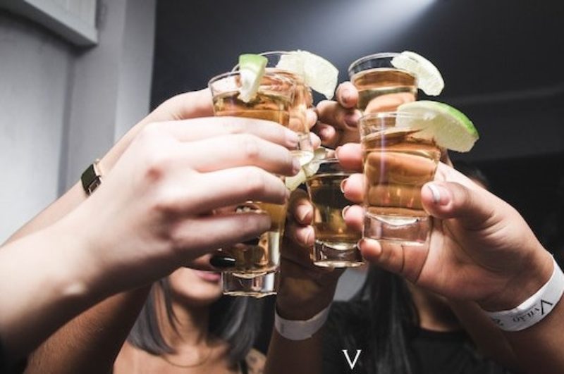 Photograph shows hands holding drinks glasses - Photo by Isabella Mendes: https://www.pexels.com/photo/photo-of-people-doing-cheers-1304475/ 