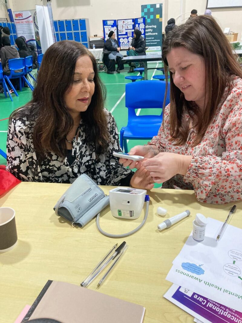 Yasmin Qureshi having her blood pressure checked